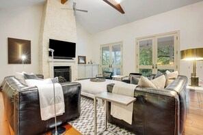 Living area - Inviting waterfront home with pool, patio, fireplace, W/D, & dog-friendly (Hunt)