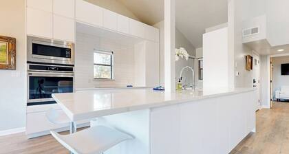 Dog-friendly waterfront retreat with a washer/dryer, furnished patio, & AC