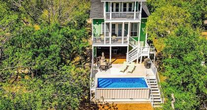 Waterfront home with game room, decks, pool, smart TVs, kayaks, & gas grill