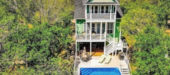 Waterfront home with game room, decks, pool, smart TVs, kayaks, & gas grill