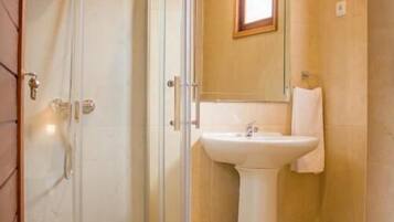 Shower, towels, soap, toilet paper