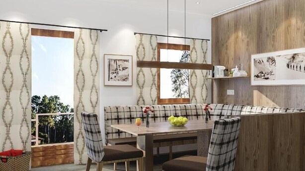 A modern dining area with a wooden table, cushioned benches, and a view through large windows. - Viktoria (Sankt Anton am Arlberg)