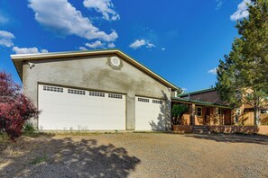 A two-story house with a garage, a front porch, and a driveway. - 1/2 Mi to Buffalo Thunder Resort: Spacious Retreat (Santa Fe)