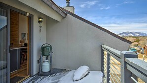 A balcony with a snow-covered ground, a water dispenser, and a view of mountains. - Modern Condo w/ Balcony & Bbq, 6 Mi to Winter Park (Fraser)