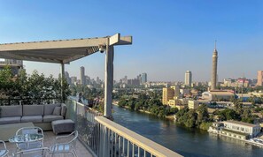 Outdoor dining - AB N401 Spacious 2BR Duplex with Partial Nile View (Giza Governorate)