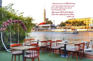 Outdoor dining - AB N401 Spacious 2BR Duplex with Partial Nile View (Giza Governorate)