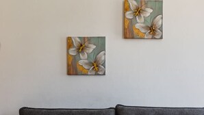 A grey sofa with a wooden coffee table in front, and two paintings on the wall. - Orikum Beachside Retreat Apartment 2 (Orikum)