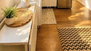 A kitchen with a stainless steel refrigerator, a microwave, a sink, and a wooden ceiling. - 564 C | Le Refuge Spa Riviere & Billard (Saint-Léon-de-Standon)
