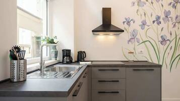 Fridge, microwave, stovetop, coffee/tea maker