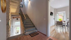 A staircase leading to a dining area with a view of the outdoors. - Civette 3, Apt 2 Bedrooms in Greve in Chianti (Greve in Chianti)