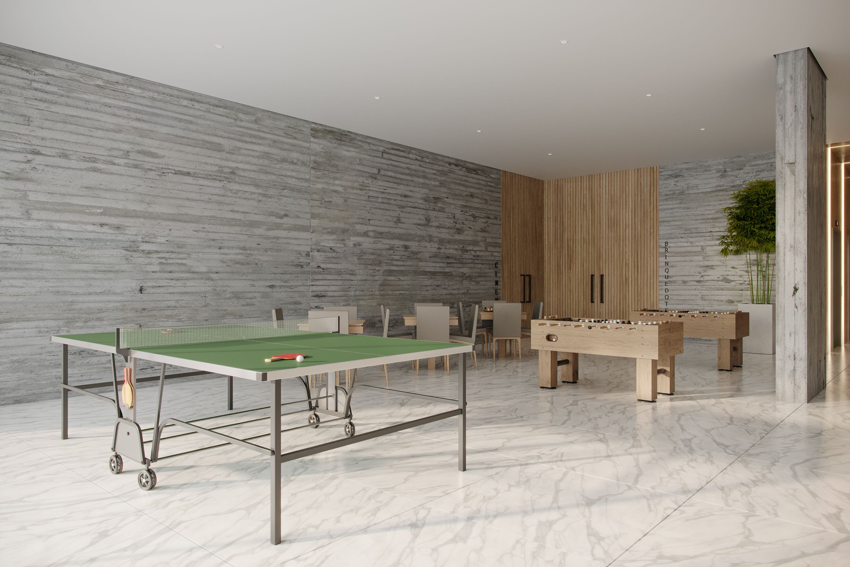 A modern indoor recreational area with a foosball table, ping pong table, and seating.