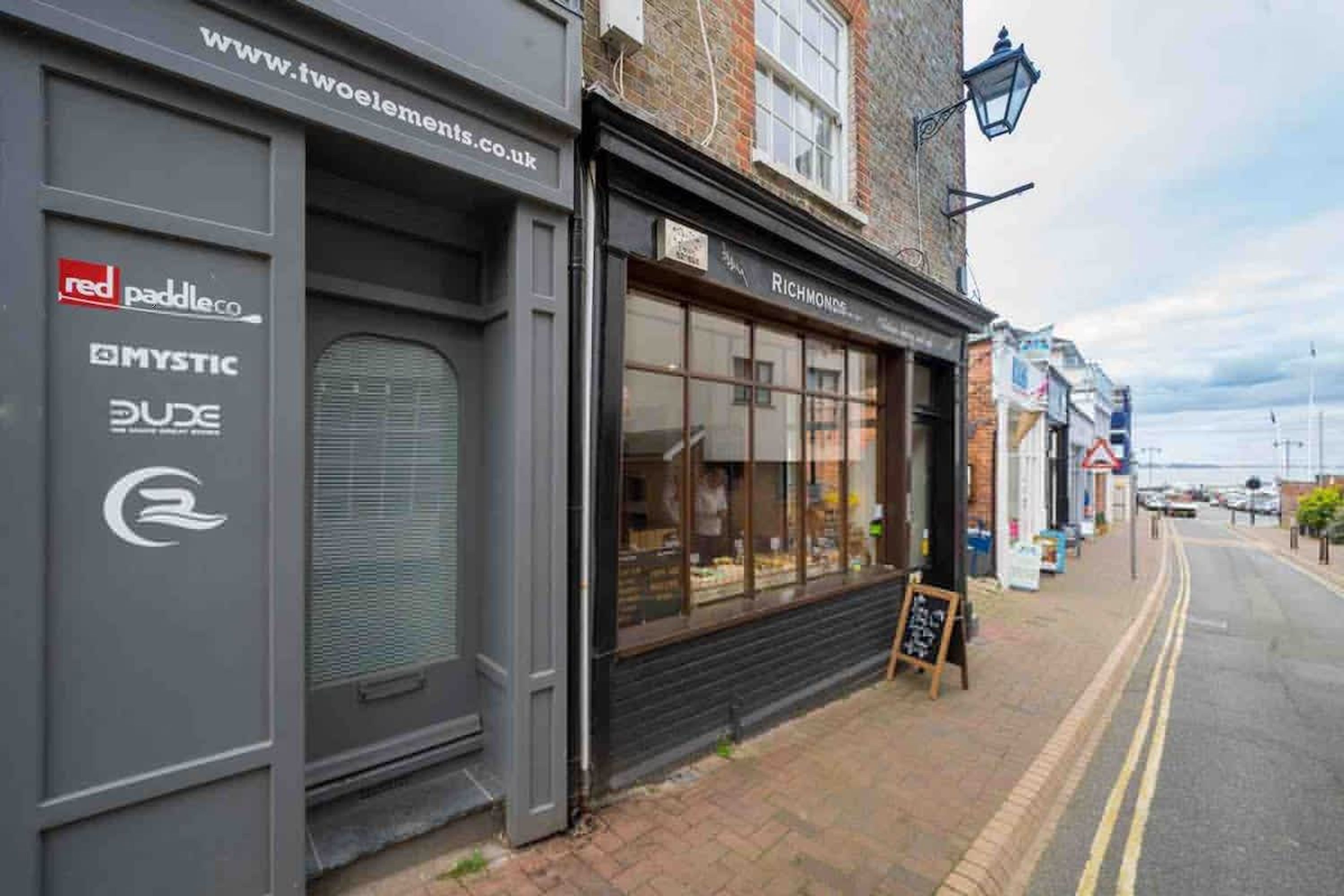 A street view with closed shops, including a visible sign for 'Richmonds.'