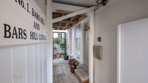 A hallway with a sign reading 'No.1. BARS HILL AND BARS HILL COTTAGE.' - Bars Hill Cottage Moments From the Seafront (Cowes)