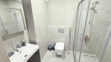 Hair dryer, towels, soap, shampoo