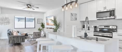 Coffee/tea maker, fridge, microwave, oven