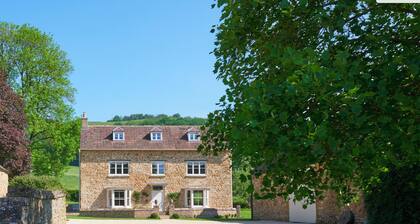 Stancombe Farmhouse, an idyllic Cotswold retreat set in its own private valley