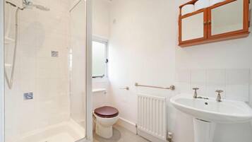 Separate bathtub and shower, deep-soaking bathtub, hair dryer, towels