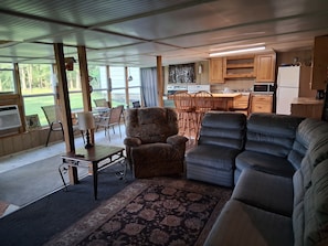 A compact living space with a kitchen, dining area, and seating.