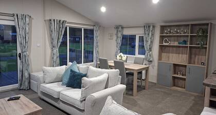 Holiday Lodge with fishing set in tranquil surroundings