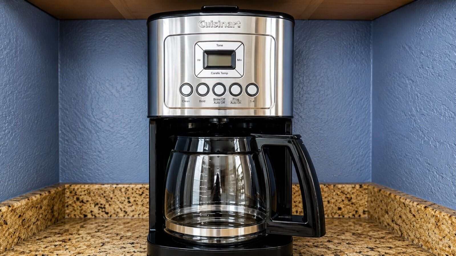 A Cuisinart coffee maker with a digital display, programmable settings, and a carafe.