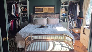 A bedroom with a bed, a wardrobe, a chair, and a desk. - Superb_Suburban_Summer (Herndon)