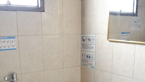 A bathroom with a toilet, sink, and trash bin. - HOTEL DEL PUENTE BOGOTA (Bogotá)