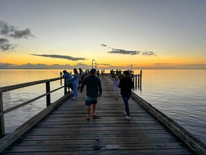A wooden pier extending into calm water during sunset. - 719 Cooloola Villa Kingfisher Bay K Gari Fraser Island (K'gari (Fraser Island))