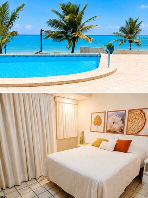A hotel room with a bed, a window with curtains, and a view of a swimming pool and palm trees.
