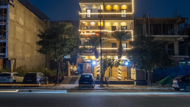 A multi-story building with a prominent illuminated sign reading 'Admire.' - OnlyStay Aspire Inn Sector 44 Noida (Noida)