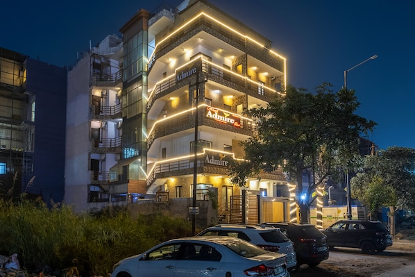 A multi-story hotel with a prominent 'Admire' sign, balconies, and a parking area. - OnlyStay Aspire Inn Sector 44 Noida (Noida)