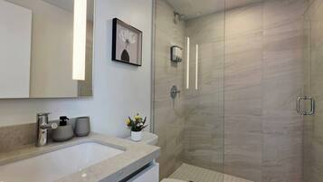 Shower, hair dryer, towels, soap