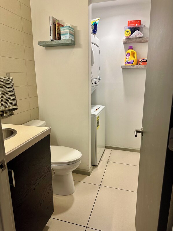 Bidet, towels, soap, toilet paper