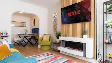 TV, fireplace, books