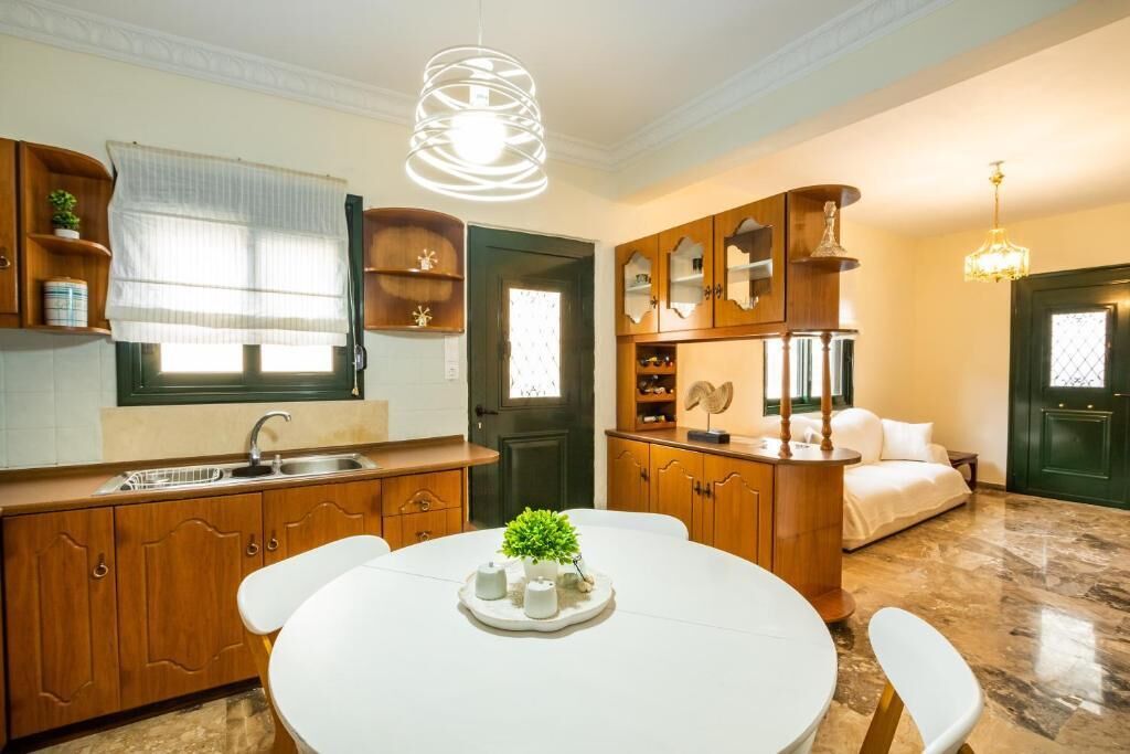 A compact living space with a kitchen, dining area, and a bedroom.
