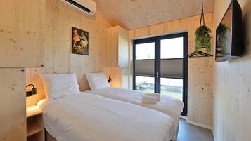 Familie huisje | Luxe beddengoed, een gratis minibar, een kluis op de kamer