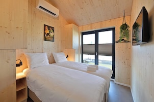 Cabaña familiar | Ropa de cama de alta calidad y minibar con artículos gratuitos