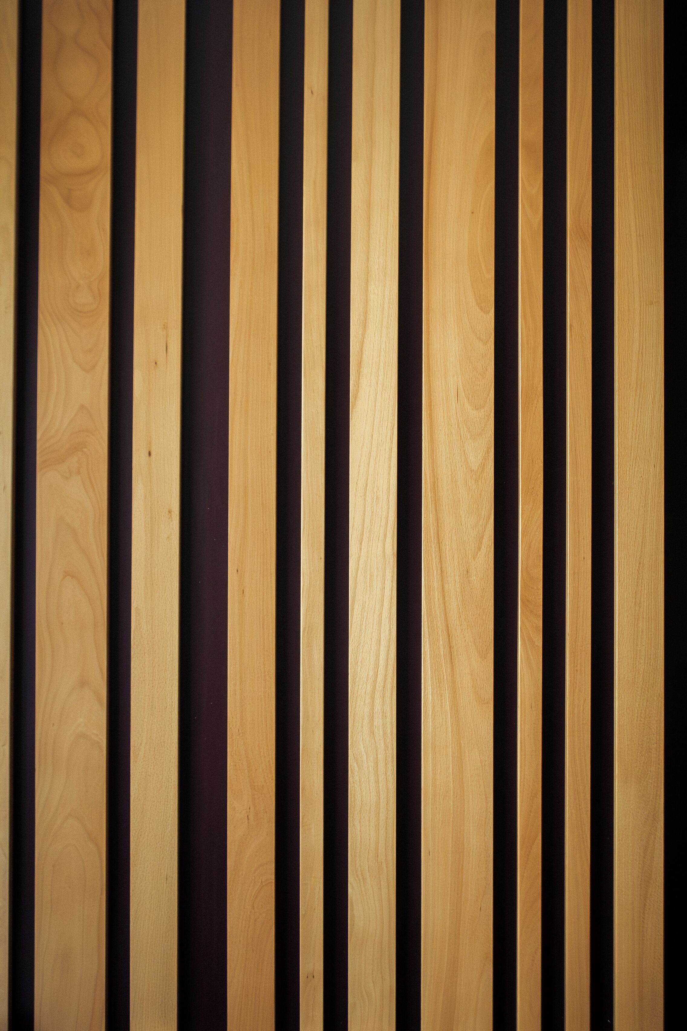A wooden wall with vertical planks.