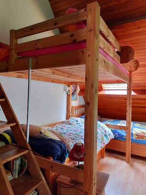 A wooden bunk bed room with a ladder, a desk, and a window. - The 3 Pignons Gourmet Retreat (Noisy-sur-École)