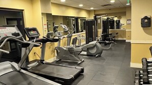 A gym with treadmills, elliptical machines, and weight equipment. - Labor Day Opening🌴Last minute PCB Getaway  The Pink Panama at Origin at Seahaven (Panama City Beach)