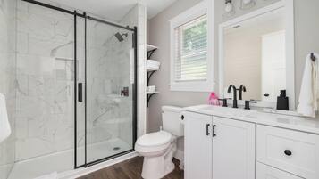 Shower, hair dryer, towels, soap