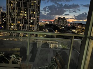 A high-rise building with a view of a cityscape at dusk. - FIFA unobstructive view CN TOWER lakeshore 1+1(den) 2b1b condo with parking (Toronto)