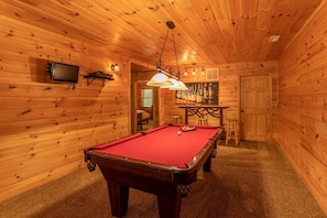 A wooden interior with a pool table, bar area, and a television mounted on the wall. - A Positive Outlook - 0 Mins to Asu, Hot Tub - Pool Table - Corner Jacuzzi (Vilas)