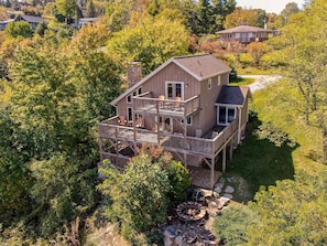 A two-story house with a deck and a fire pit in the backyard. - Aspen View (Blowing Rock)