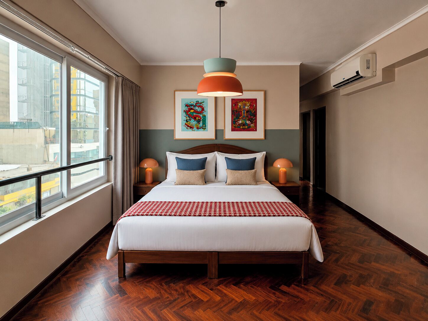 A hotel room with a large bed, two bedside lamps, a window with a view of buildings, and artwork on the wall.