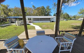 Outdoor dining - Froggies Fish Camp - Peaceful Waterfront Escape with Dock & Direct River Access! (Satsuma)