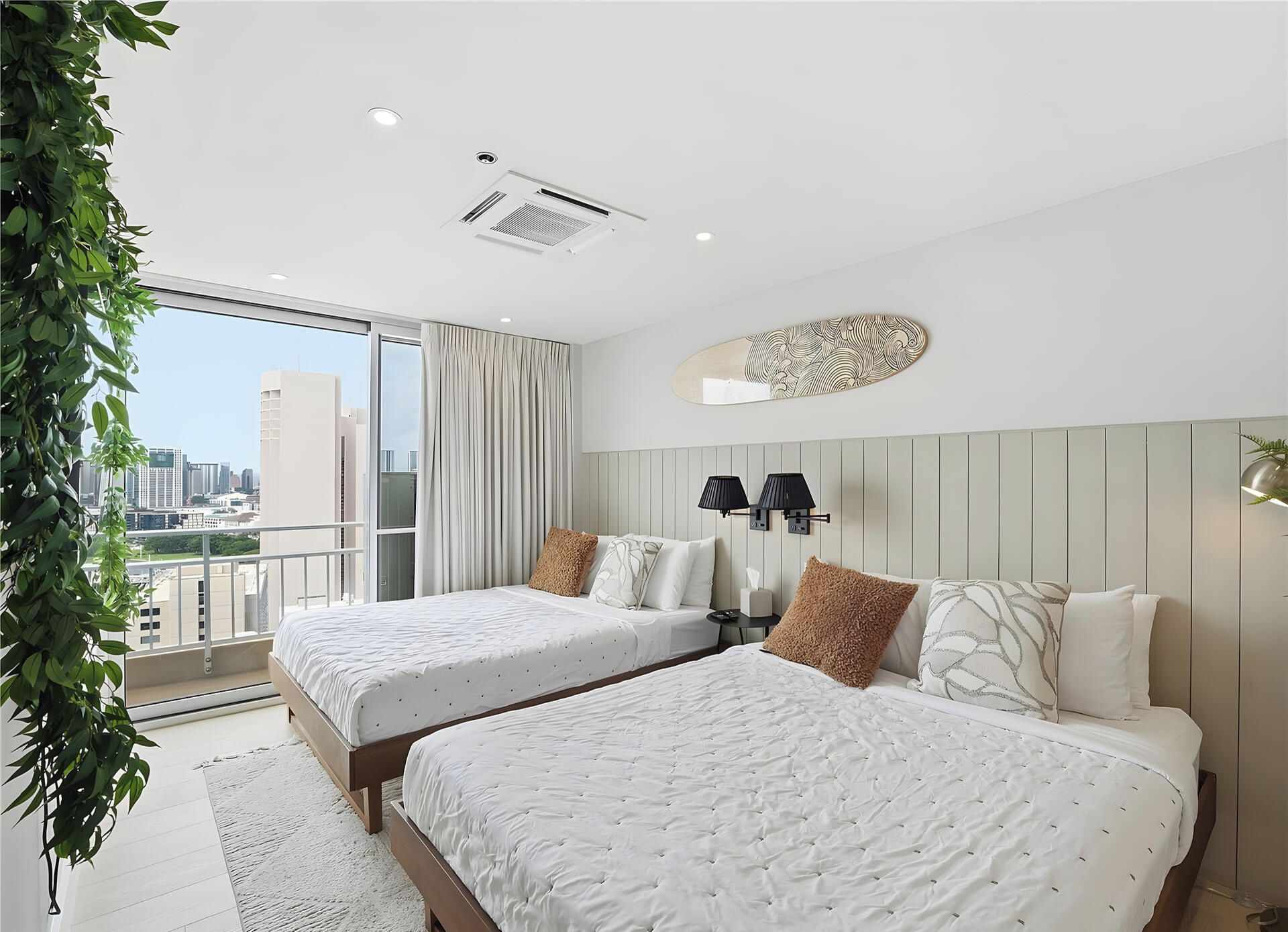 A modern hotel room with two beds, a large window, and a city view.