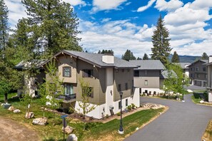 A residential building with a sloped roof, multiple windows, and a well-maintained lawn. - Downtown McCall Retreat | Walk Everywhere (McCall)