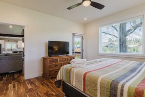 A bedroom with a bed, a television, a dresser, and a window with blinds. - 3BR Pet-Friendly Home | Fire Table, Fenced Yard + PLPOA Lake Access (Pagosa Springs)