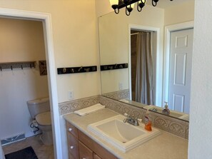 A bathroom with a sink, mirror, and towel rack. - Amazing Views, Family-Friendly 3 Bdrm Boulder Townhome Open Space, 10mns Dntown! (Boulder)