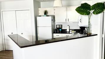 Coffee/tea maker, fridge, microwave, oven